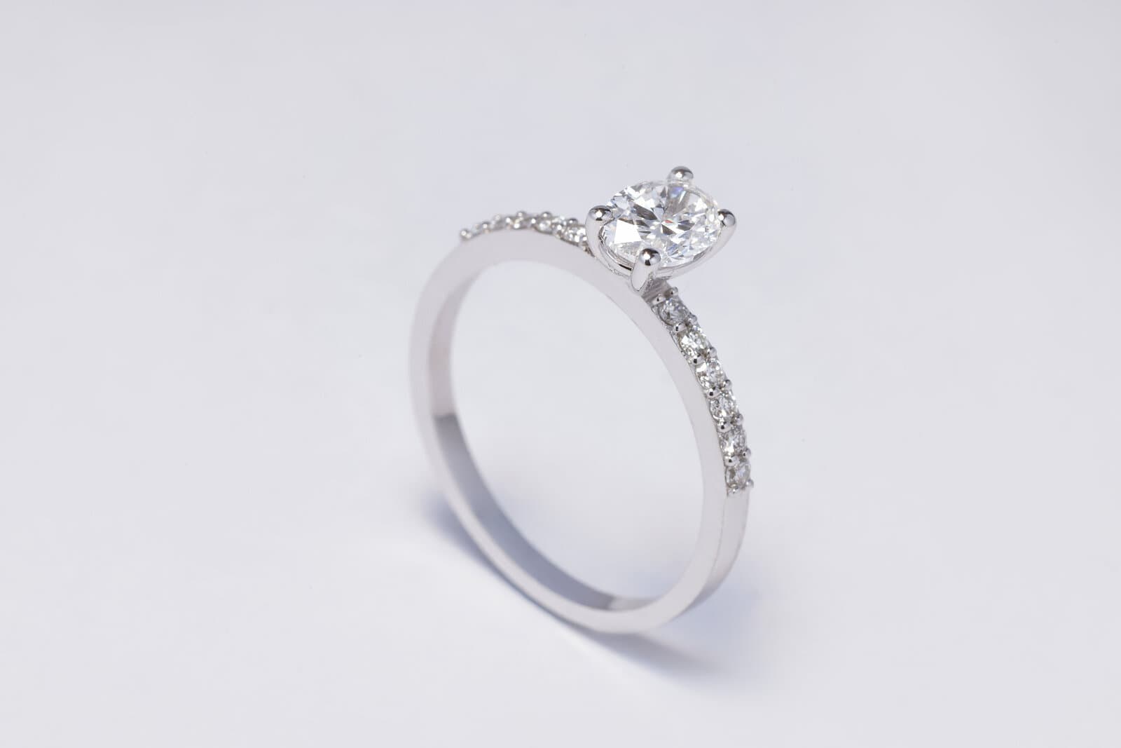 A classic solitaire ring featuring an oval diamond at the center - 2