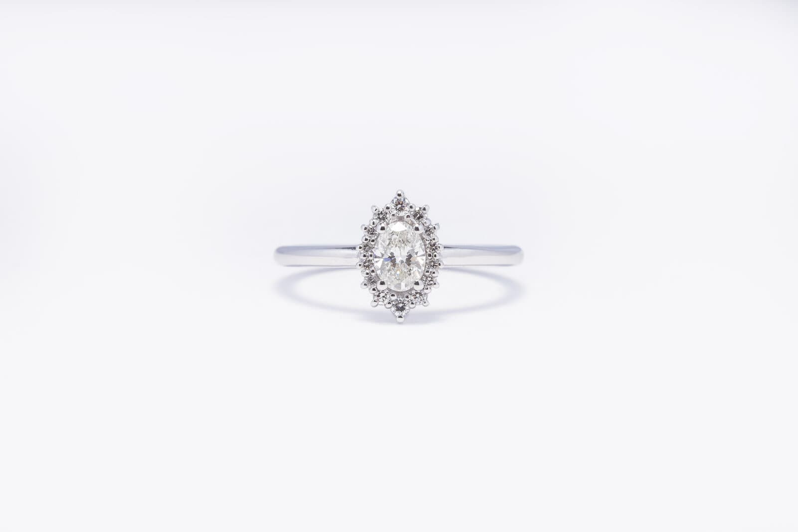 Handcrafted oval shaped diamond ring with a halo